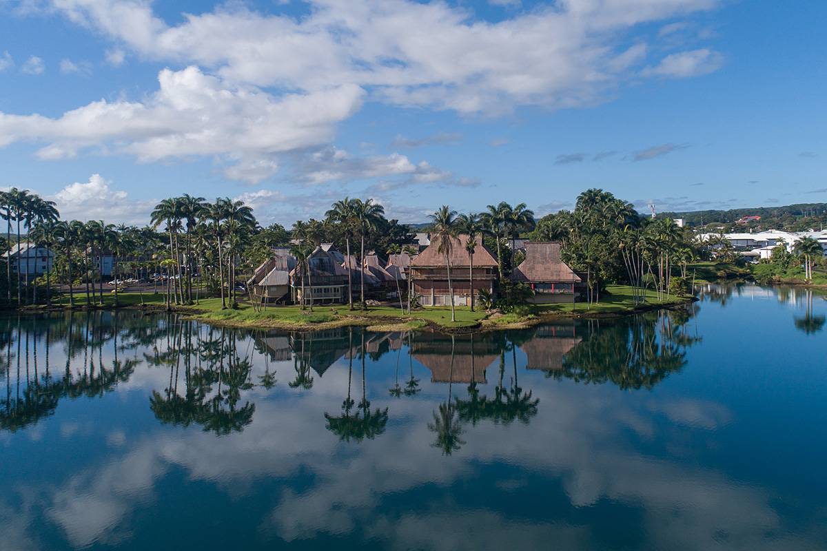 a view of a lake with houses in the back