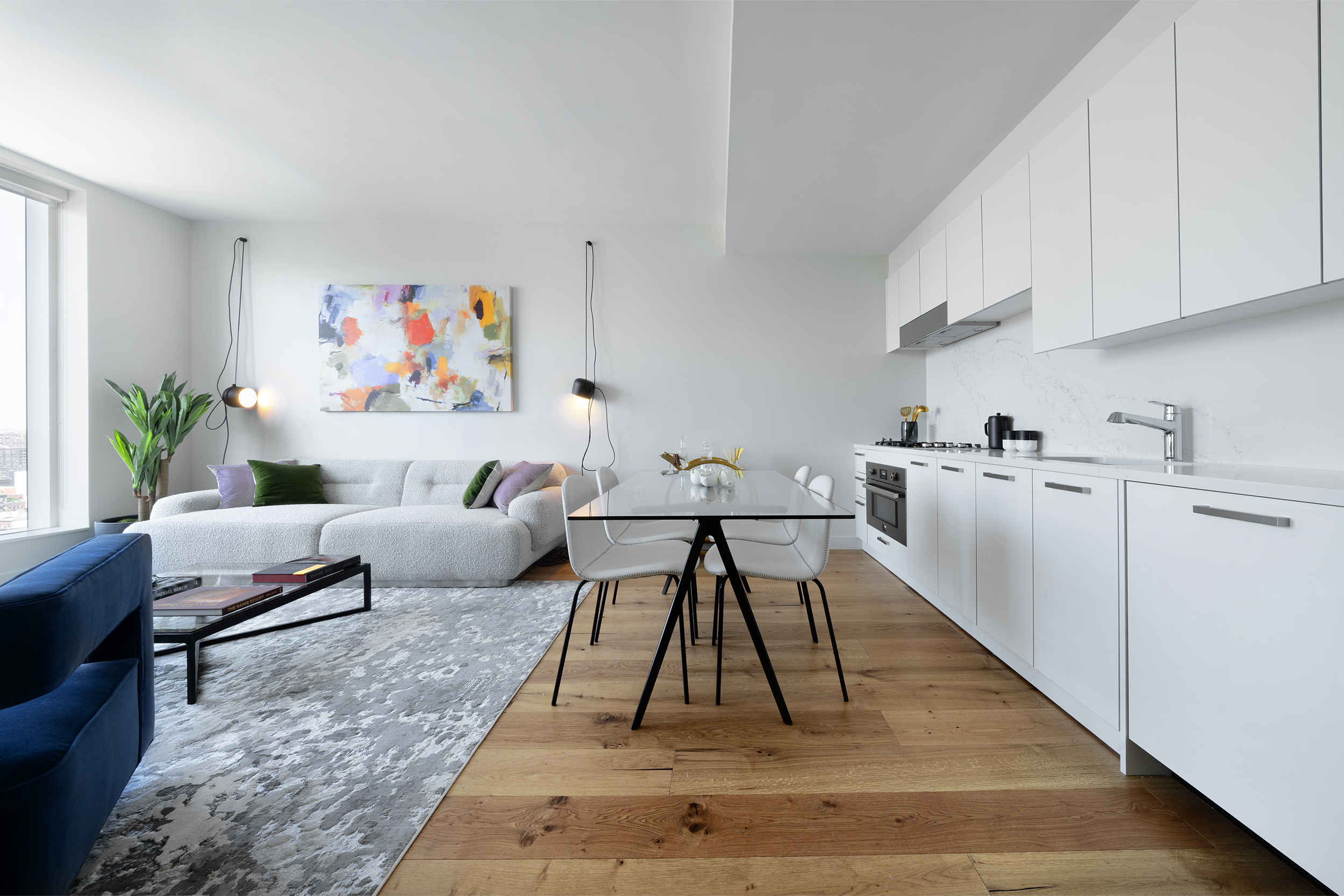 a living room with furniture and a rug