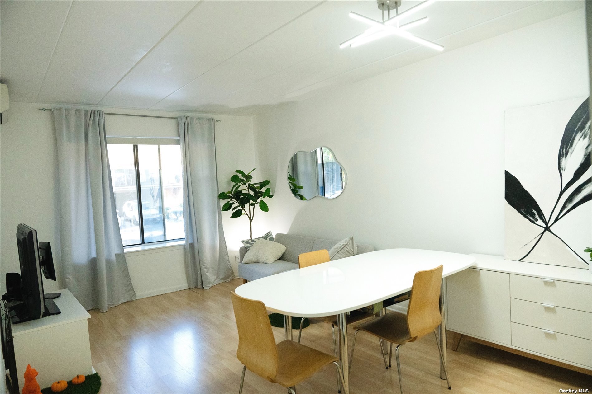 a view of a dining room with furniture and window