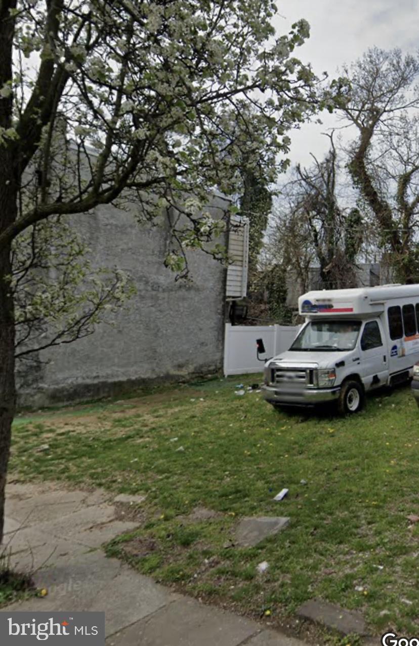 a view of a car parked in a yard