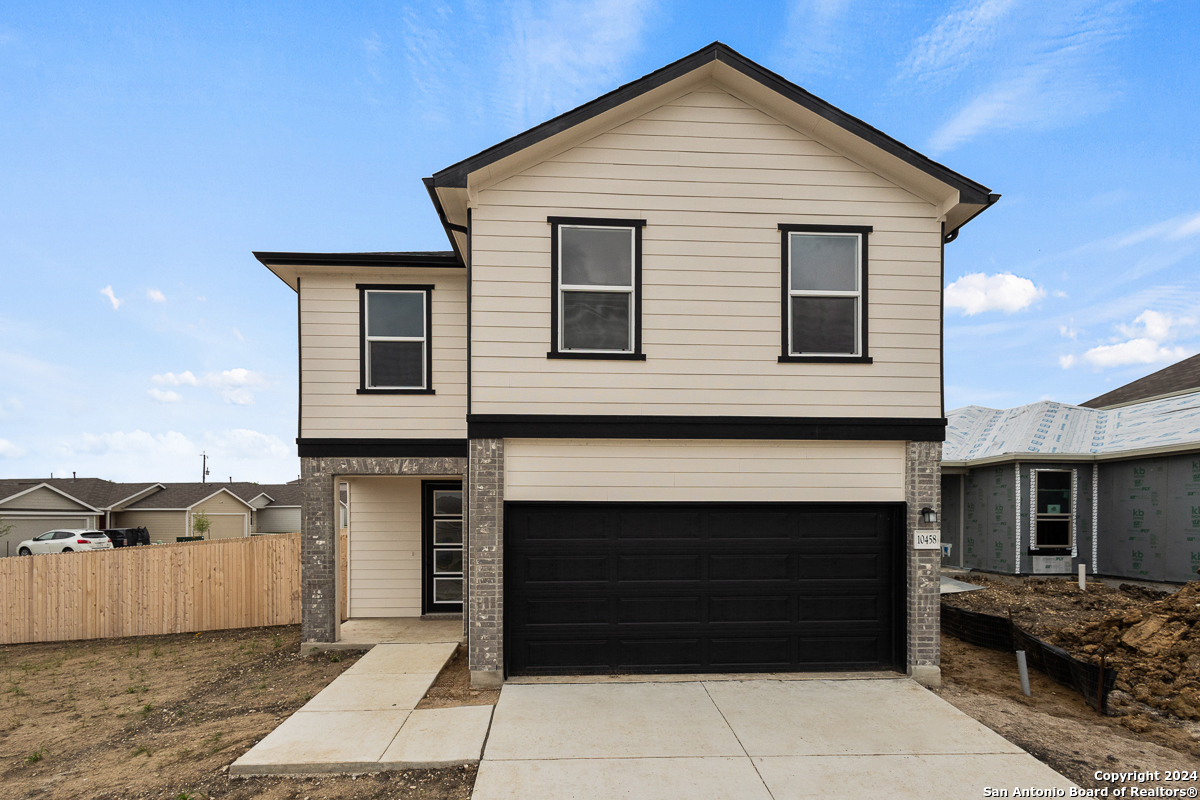 a front view of a house with a garage