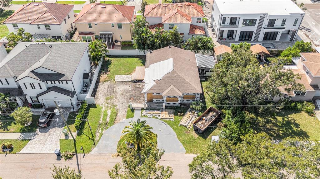 an aerial view of a house with a swimming pool