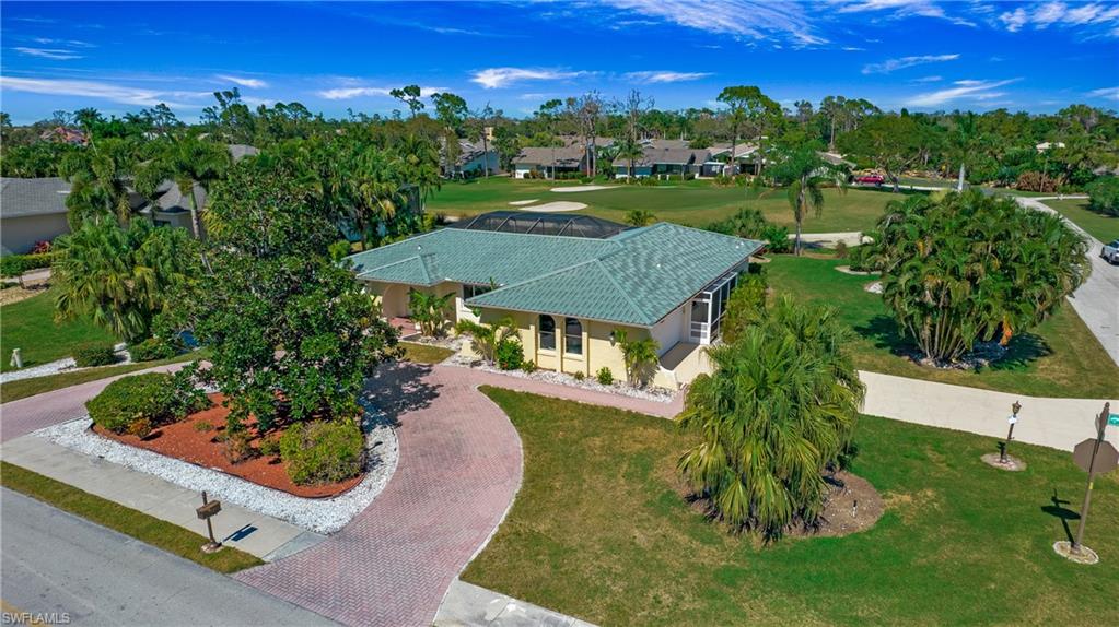 an aerial view of a house with a garden