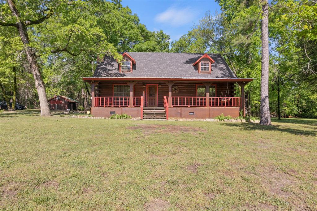 front view of a house with a big yard