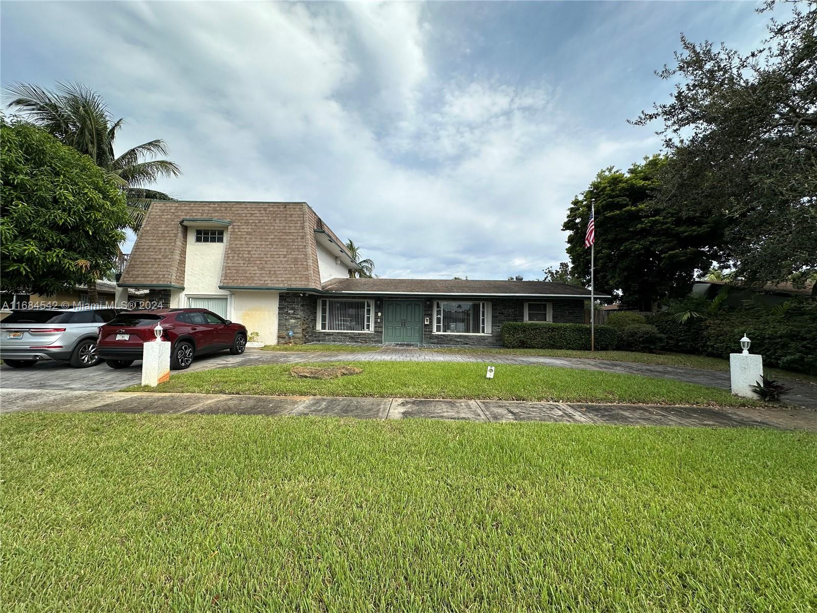 a view of a house with a big yard