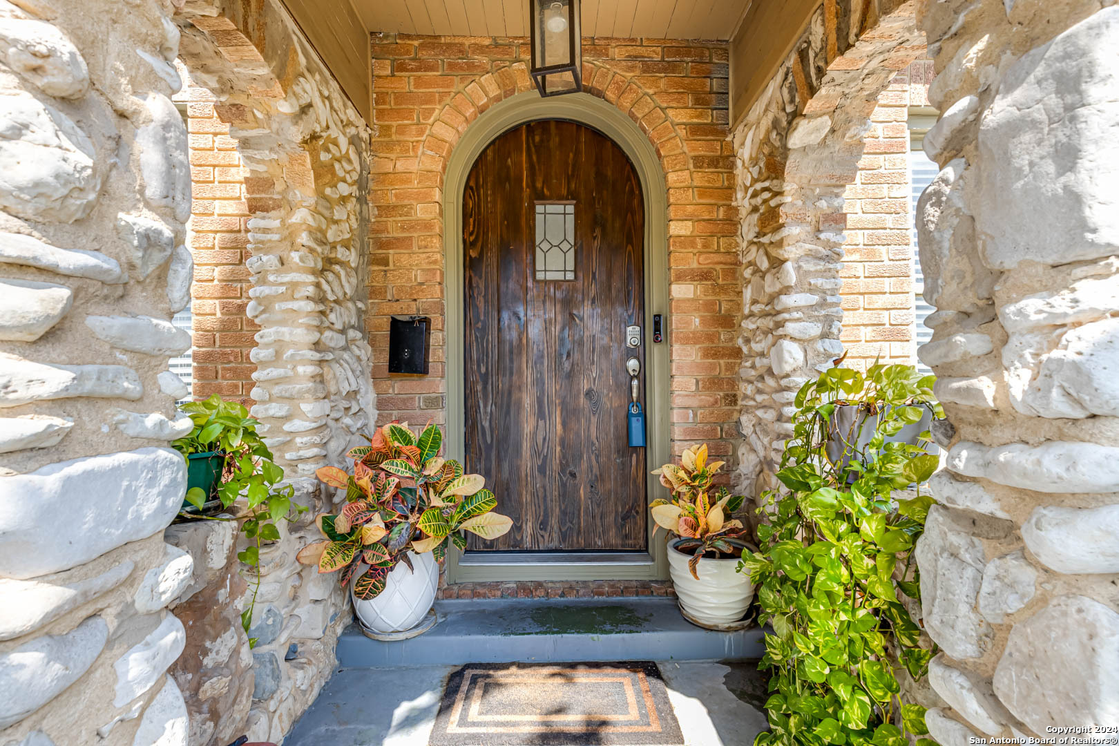 a front view of a house with outdoor seating