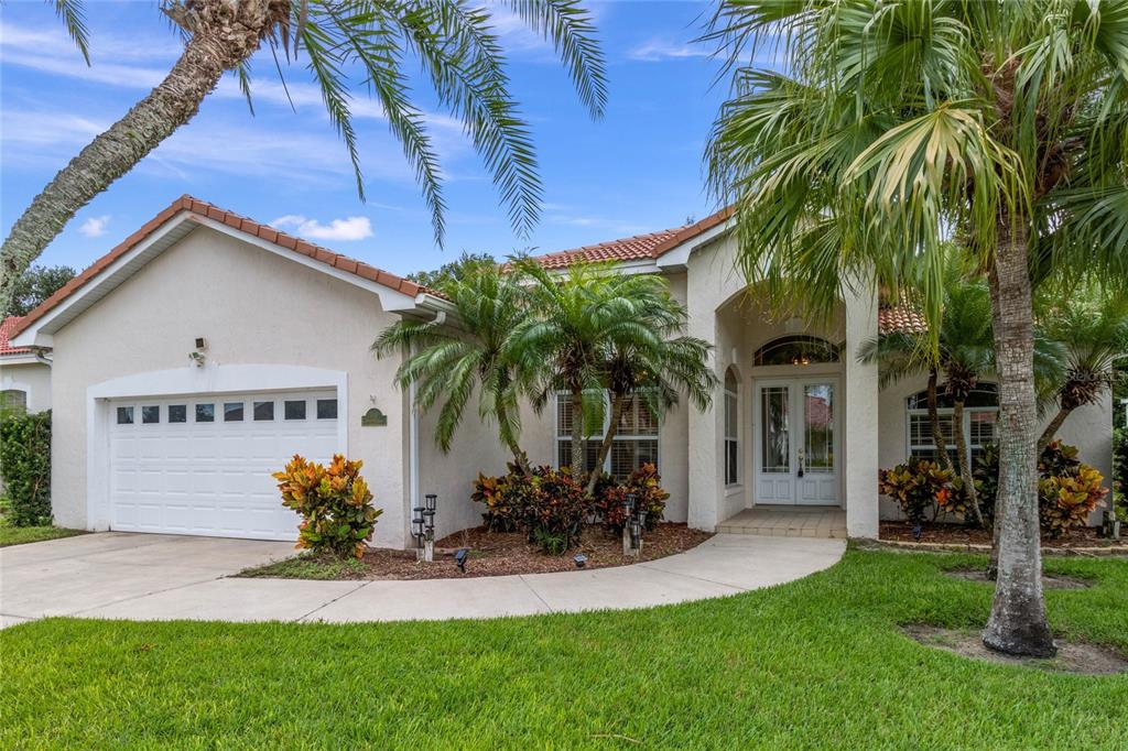 a view of house with yard and entertaining space