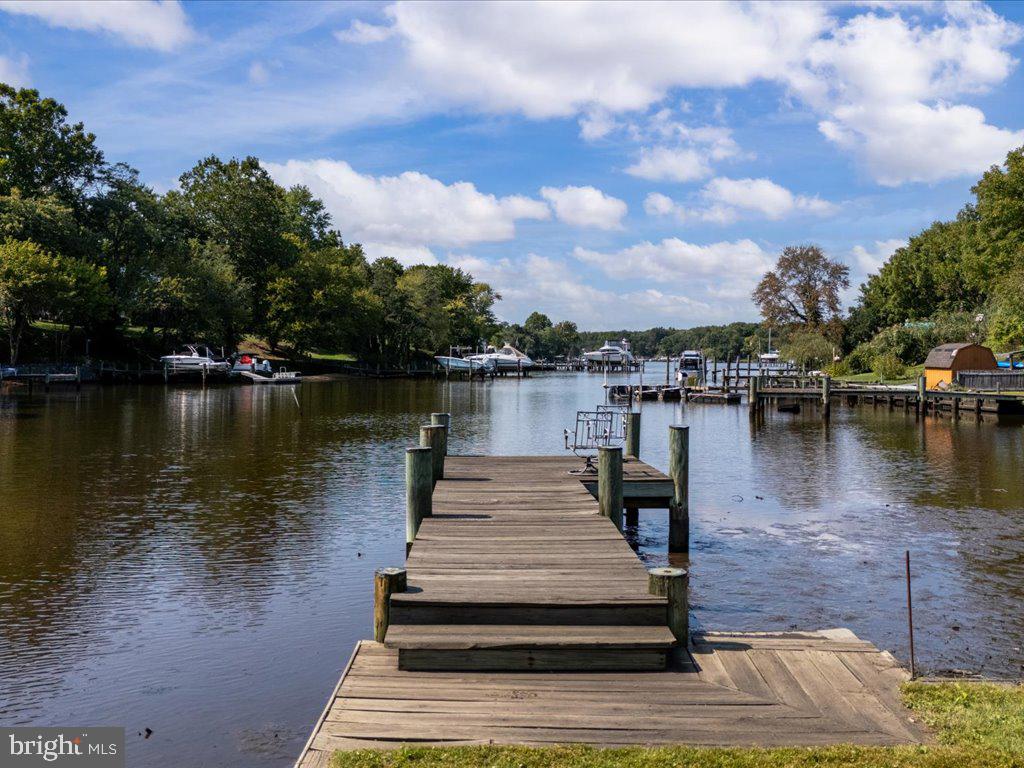 a view of a lake with houses in the back