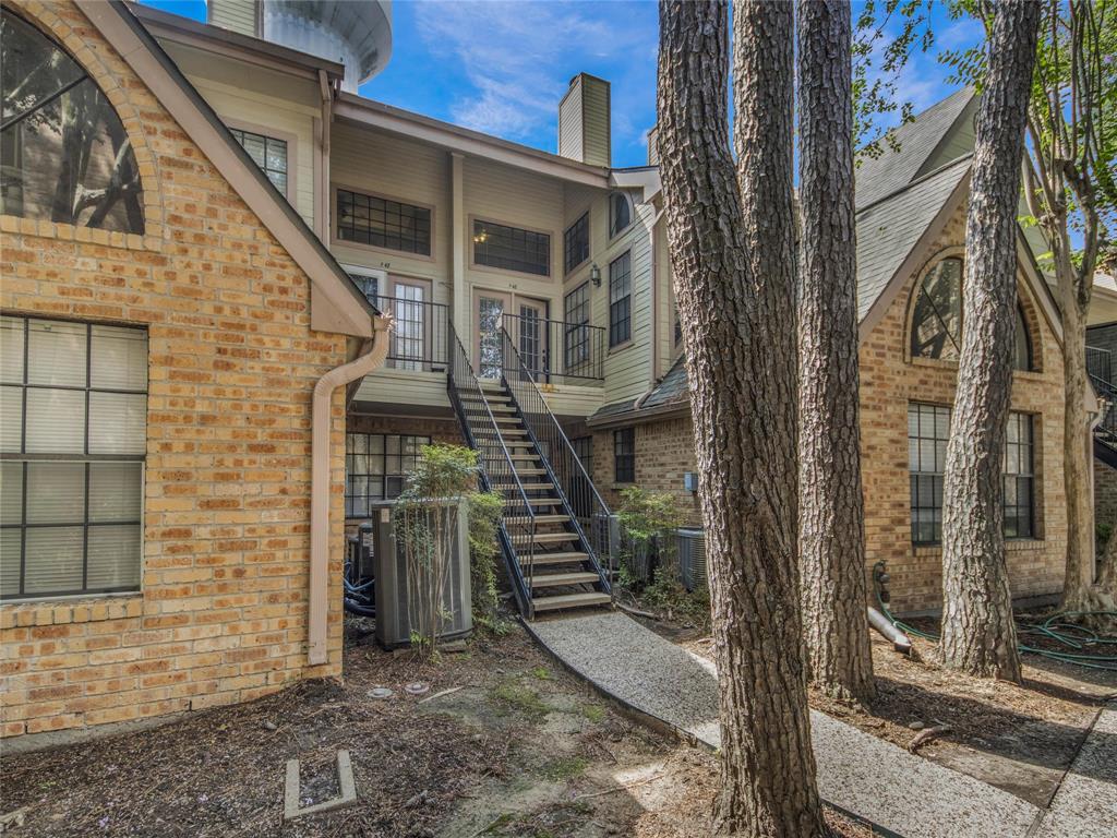 a front view of a house with stairs