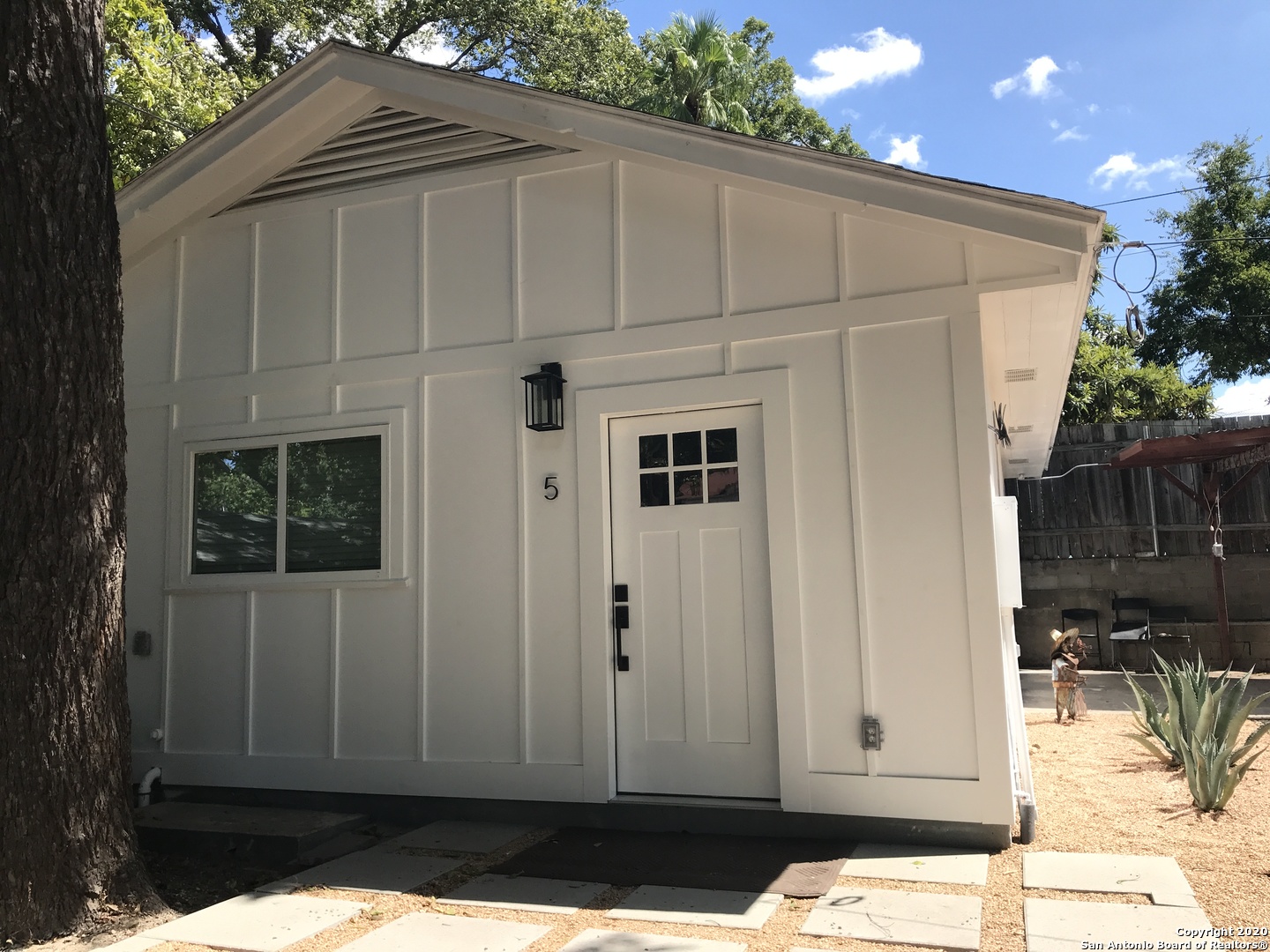 a view of backyard with cabin