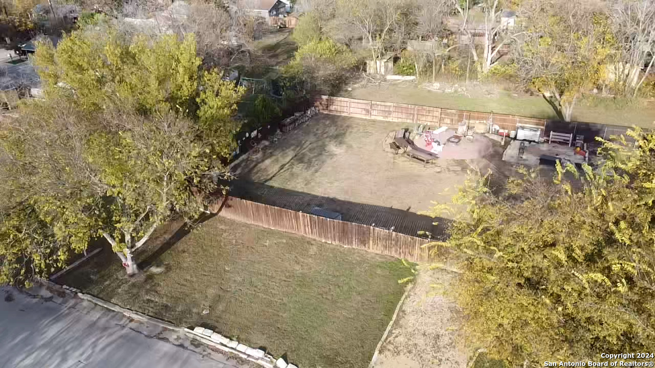 a view of a pathway both side of house