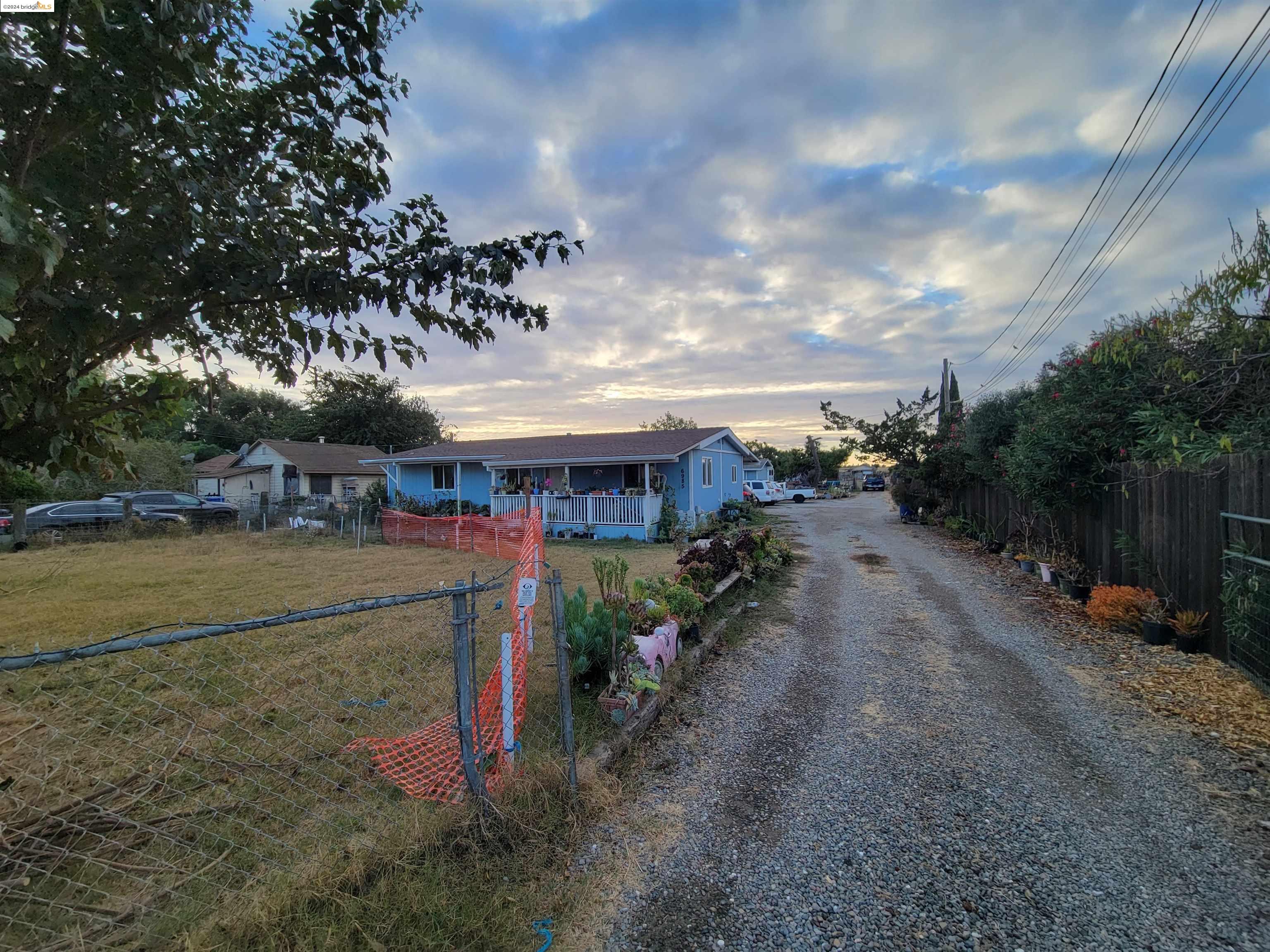 a view of a town with barn house