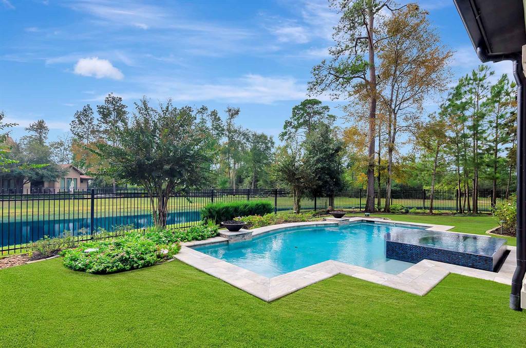 a view of a swimming pool with a patio