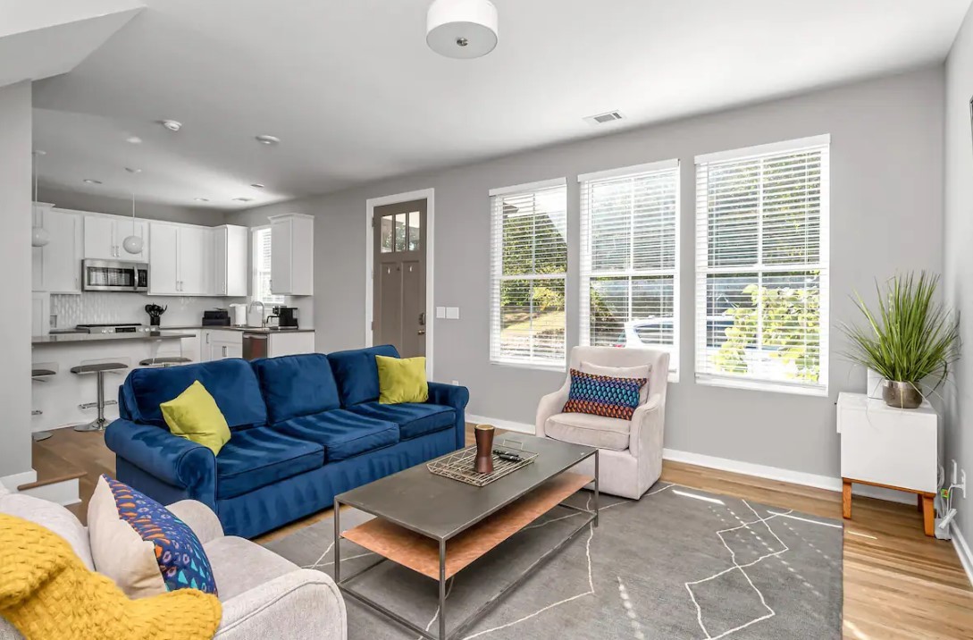 a living room with furniture and a large window