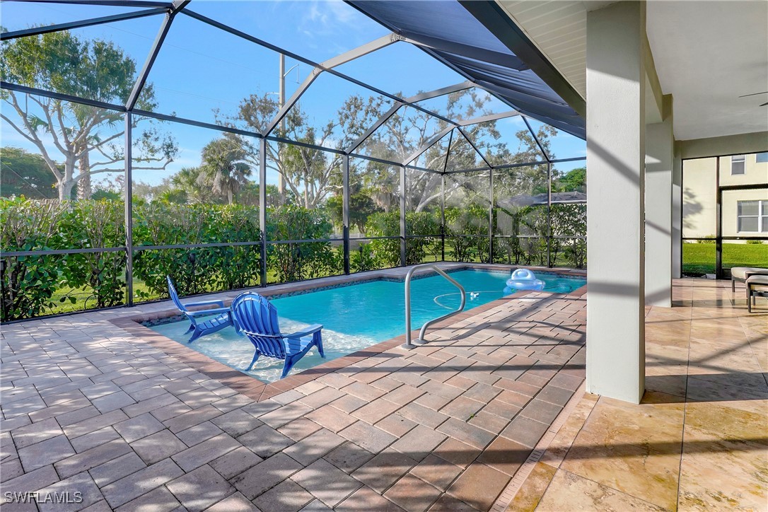 a view of a swimming pool with a patio