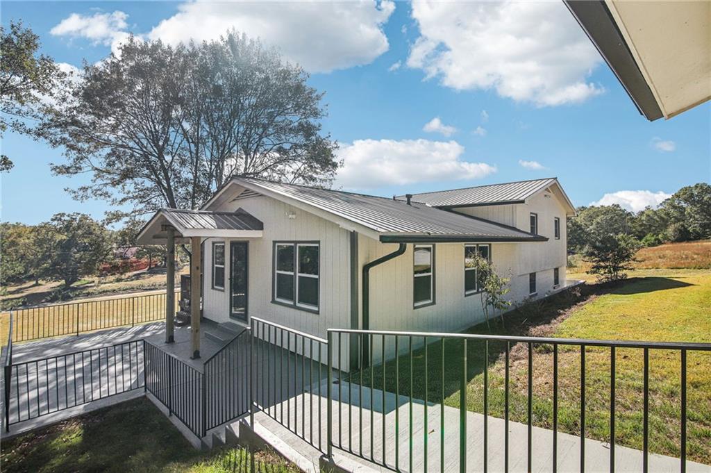 a view of a house with a wooden deck