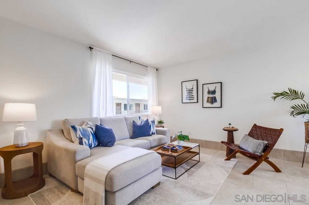 a living room with furniture and a window