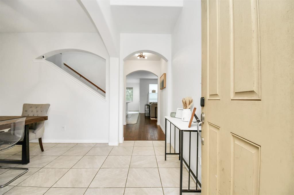 a view of a hallway with seating area