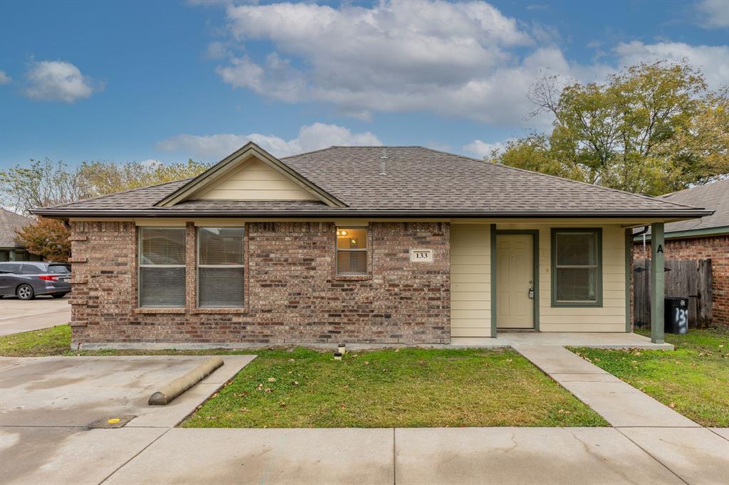 front view of a house with a yard