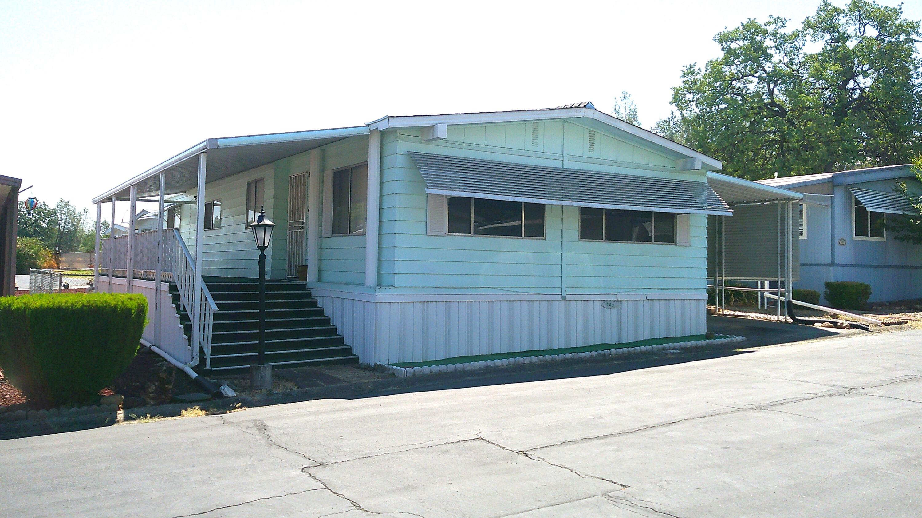 a front view of a house with garage