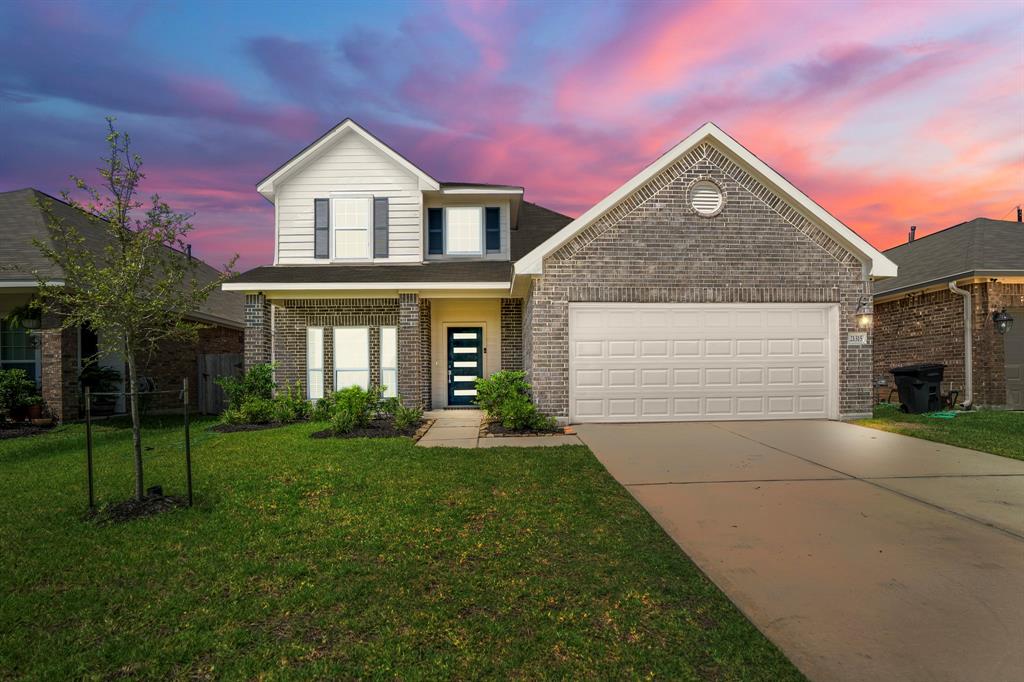 front view of a house with a yard