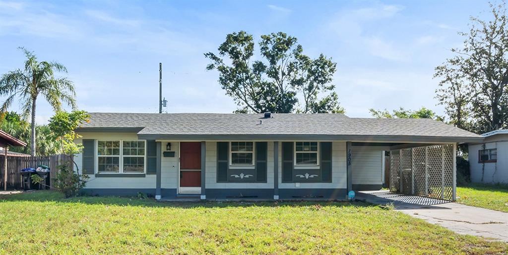 a front view of a house with a yard and porch