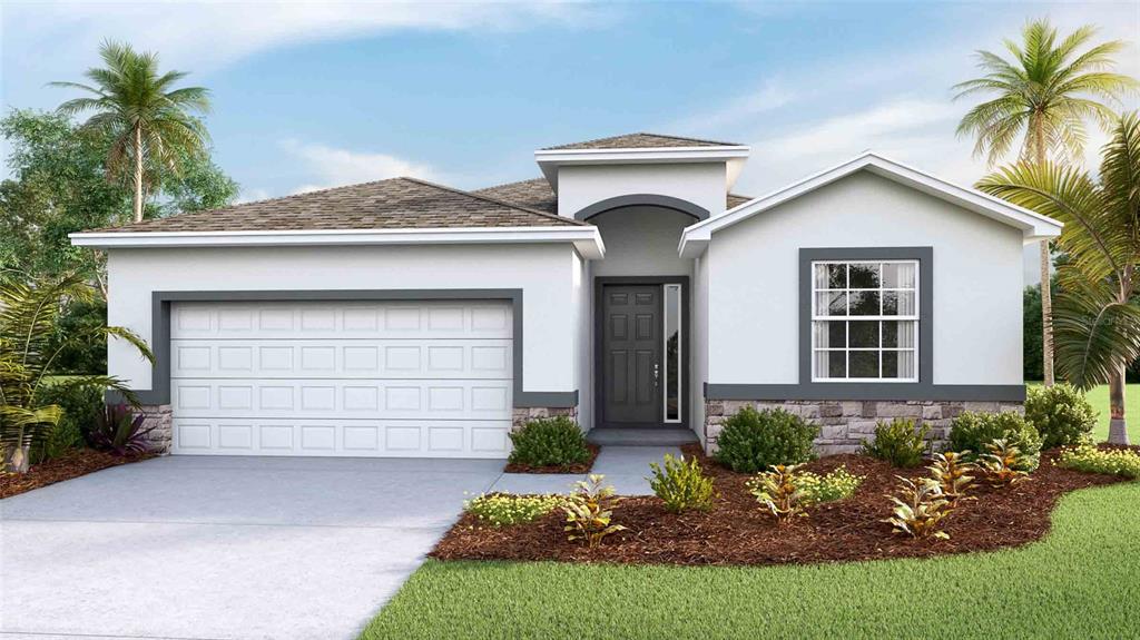 a front view of a house with a yard and garage