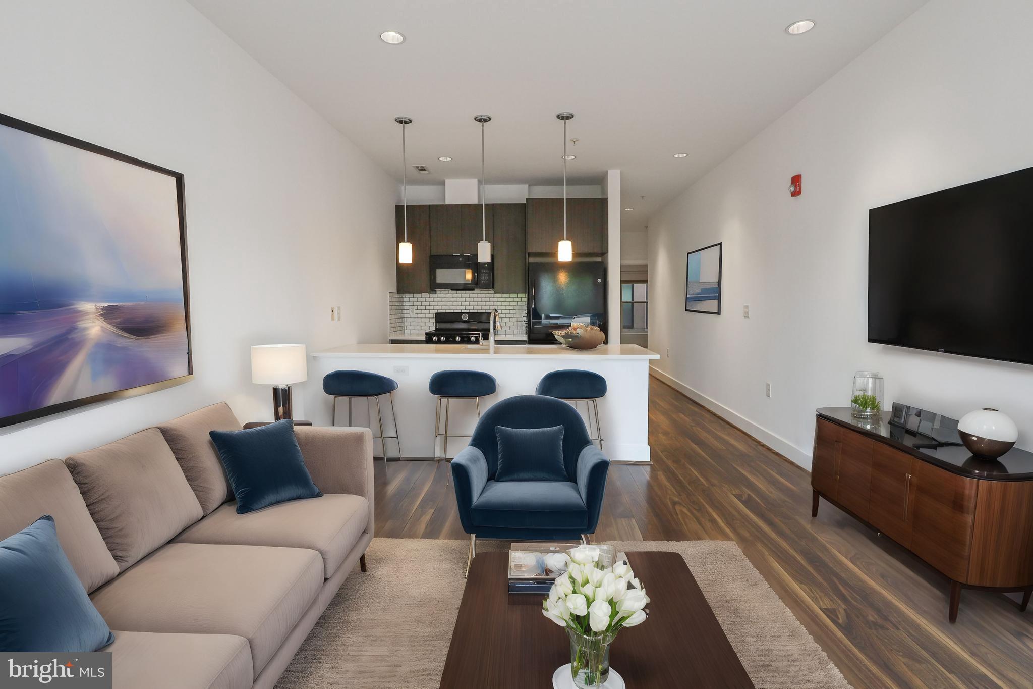 a living room with furniture and a flat screen tv