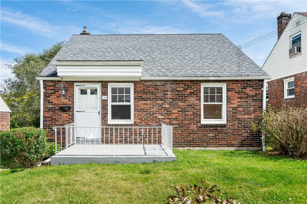 front view of a house with a yard