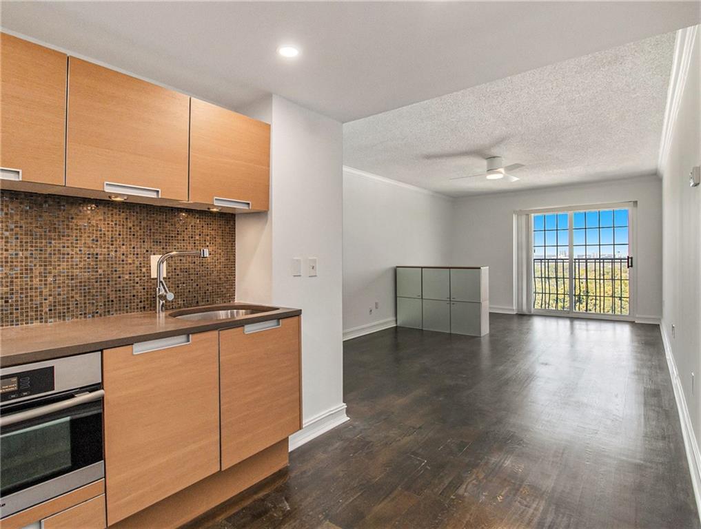 a kitchen with stainless steel appliances granite countertop a stove and a refrigerator