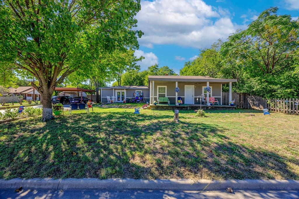 a view of a house with a big yard