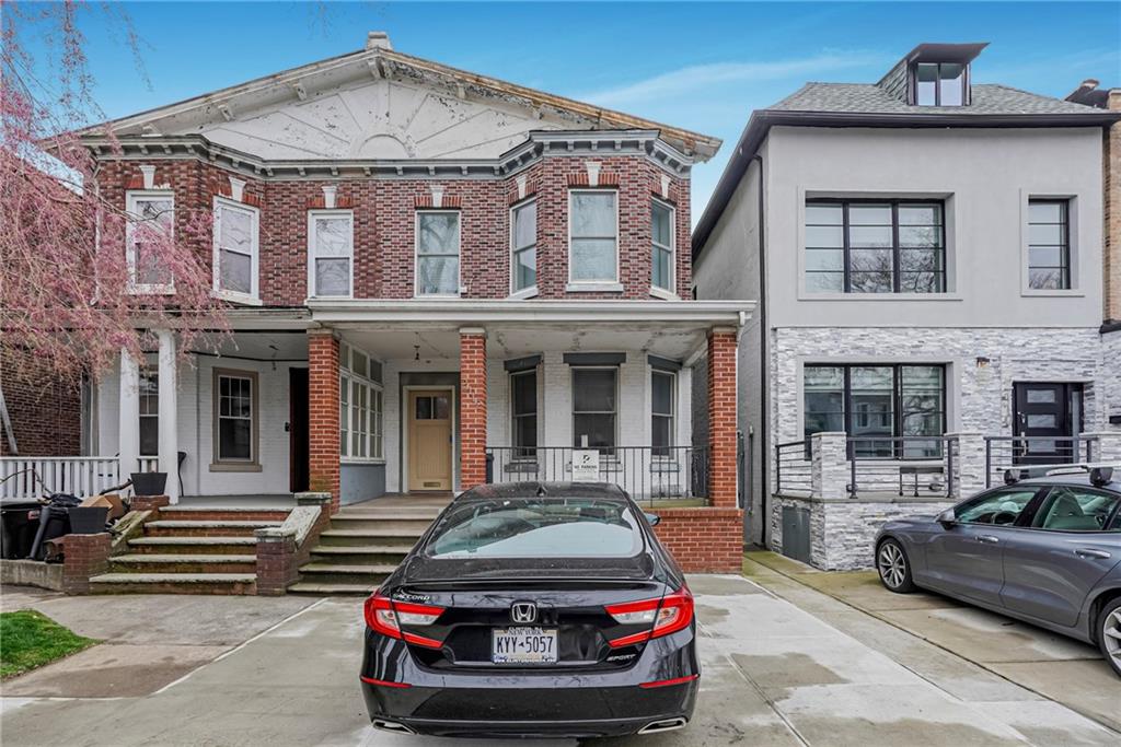 a car parked in front of a house