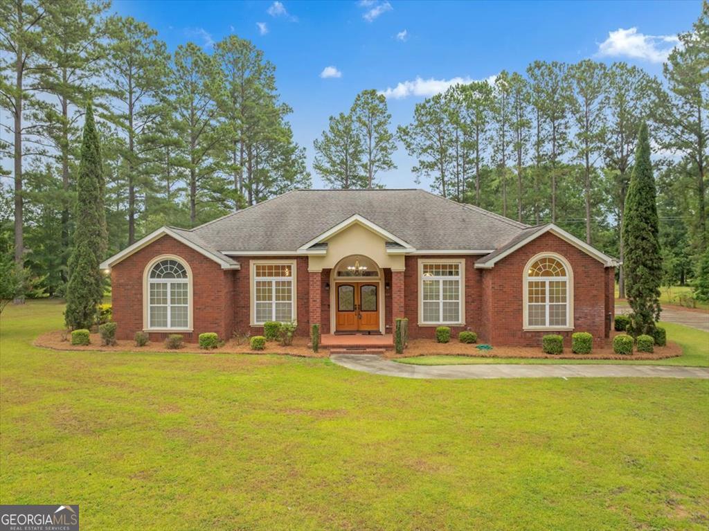 a front view of a house with a yard