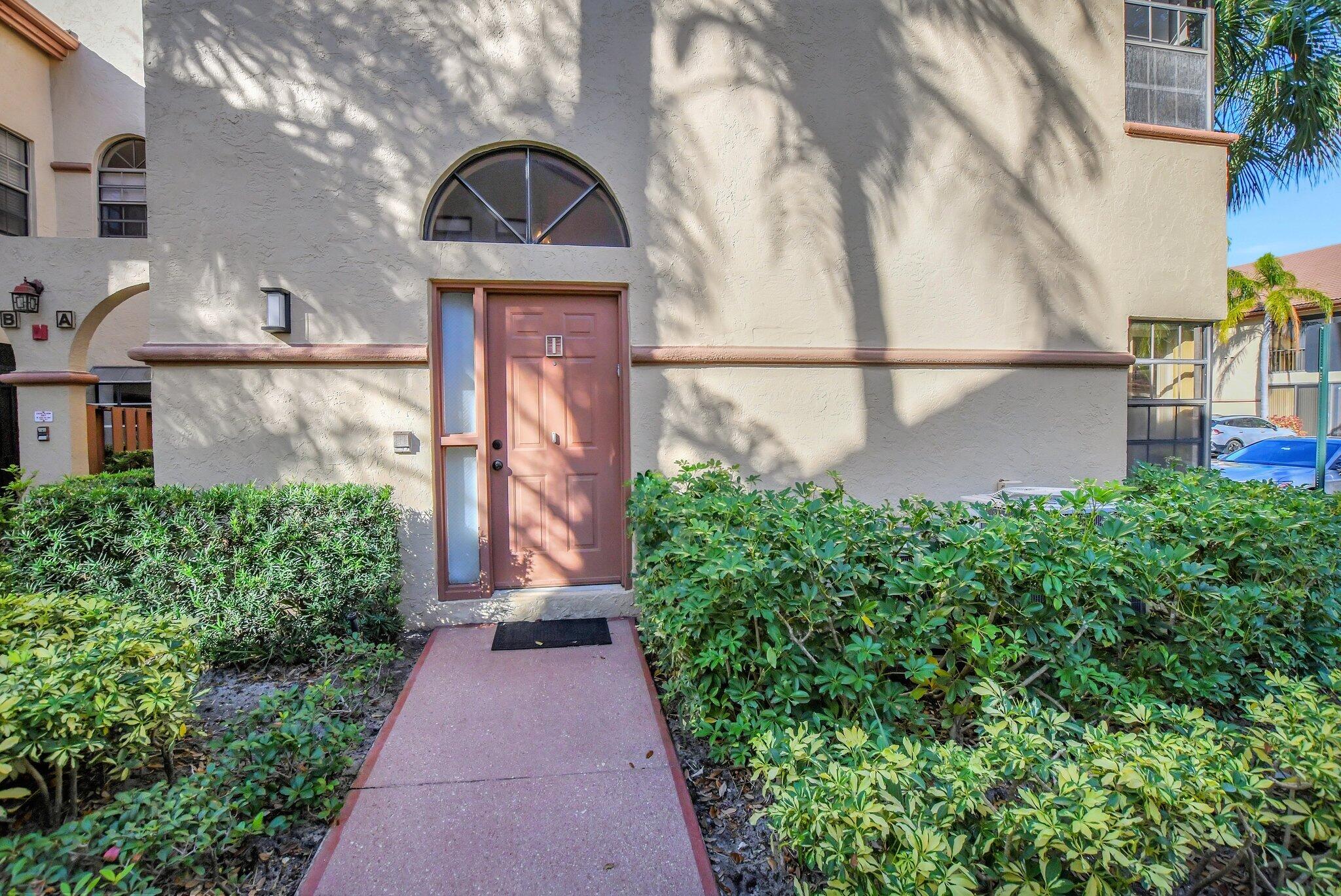 a view of a pathway in front of house