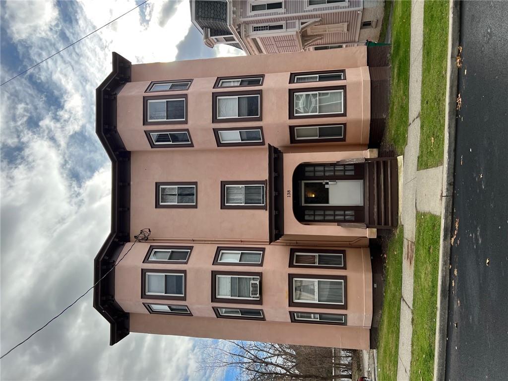 View of front of property featuring a front yard