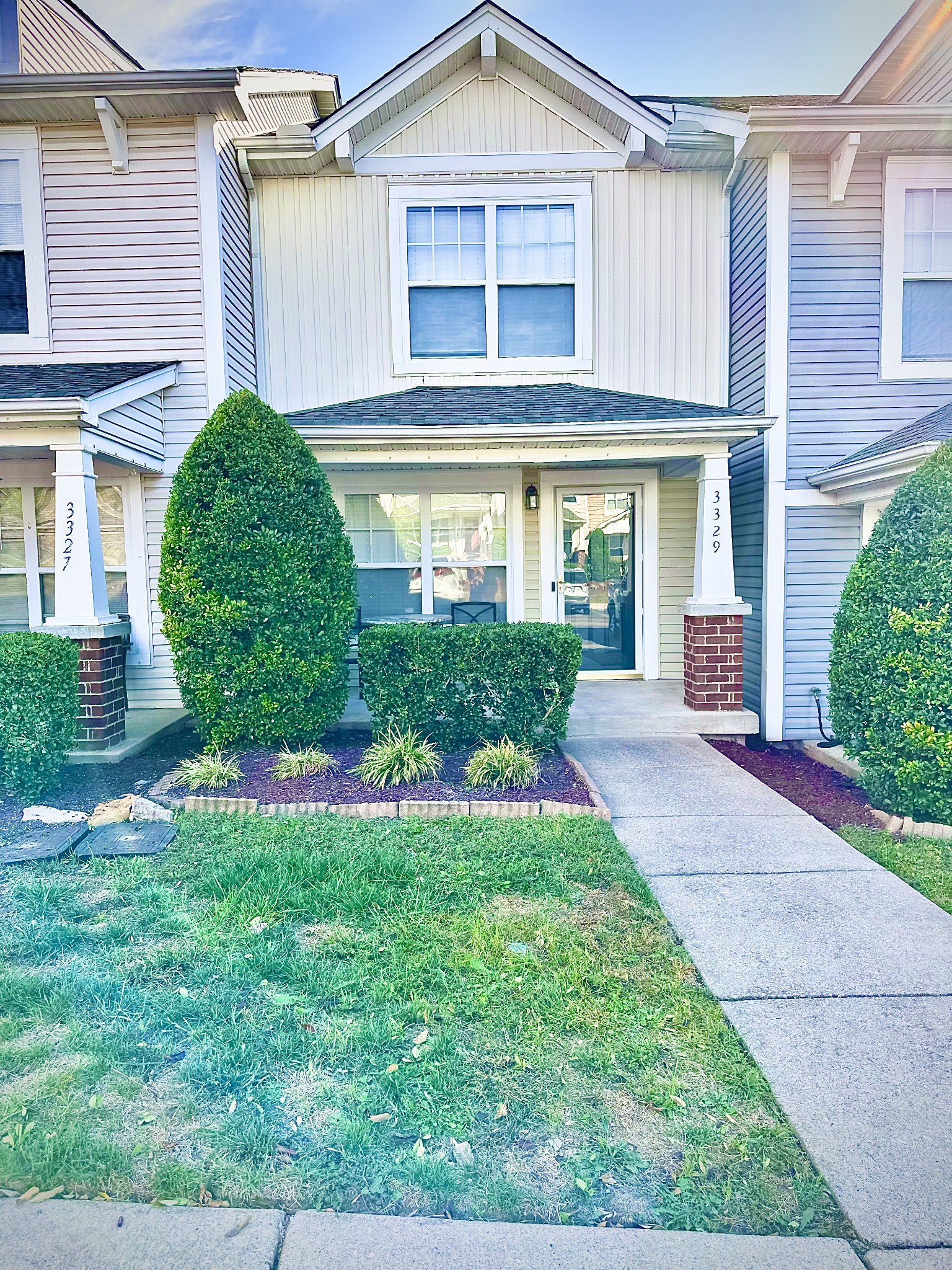 front view of a house and a yard