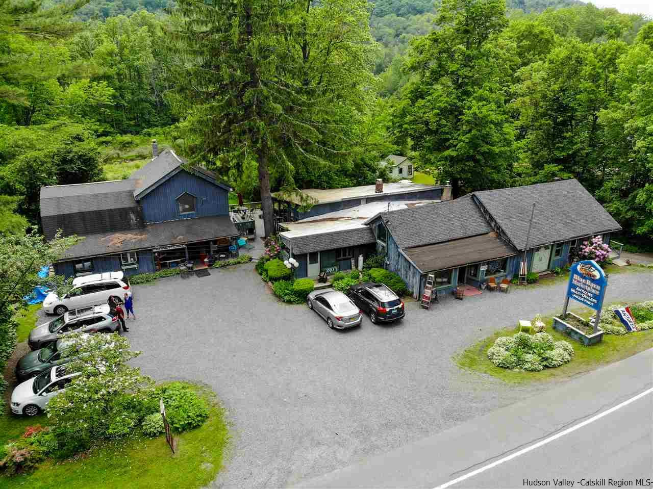 an aerial view of a house with garden and parking space