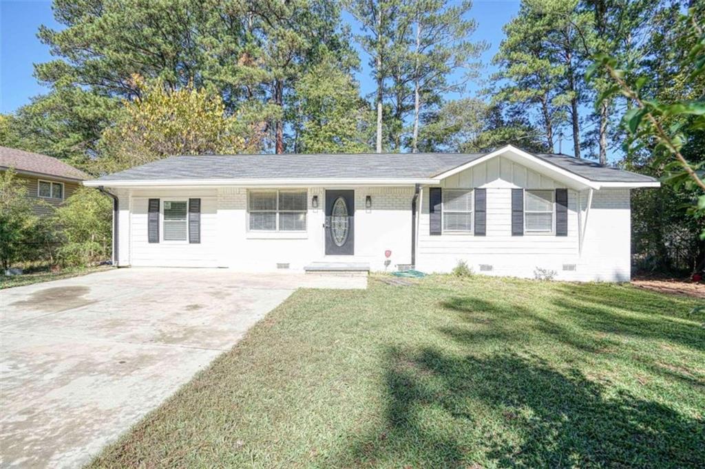 front view of a house with a yard