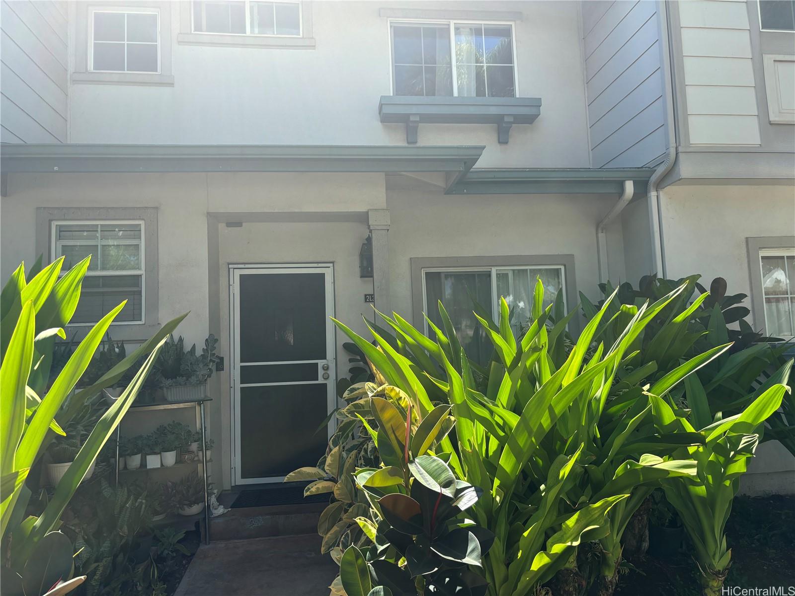 a plant is in front of a house