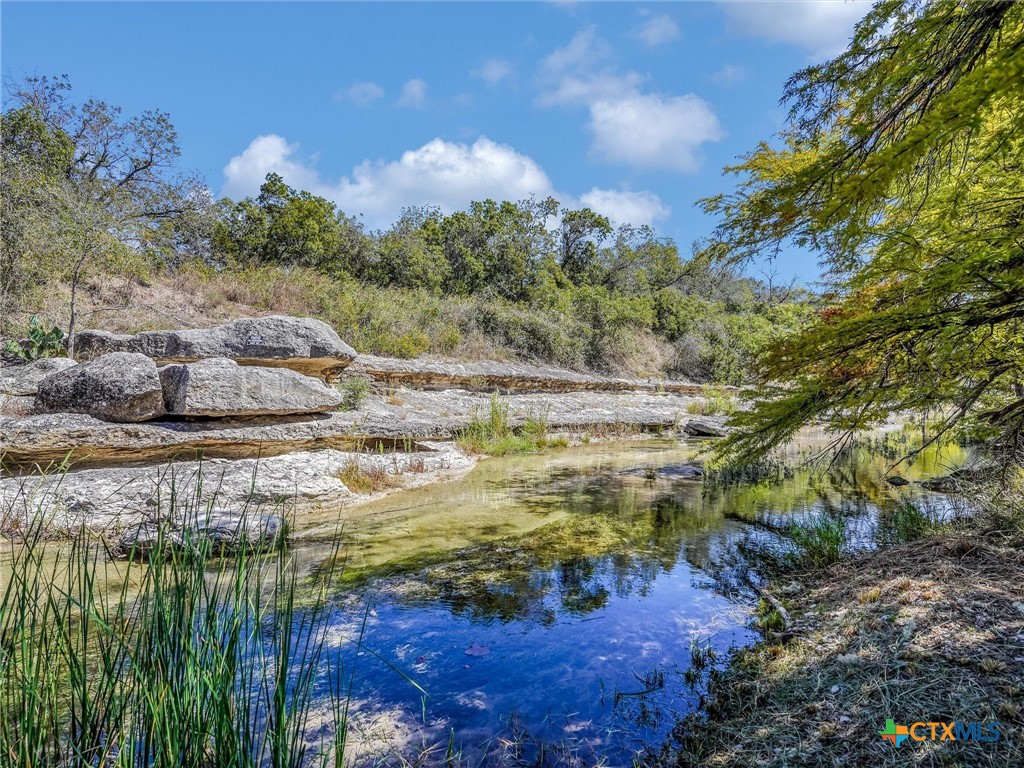 a view of a lake with a yard