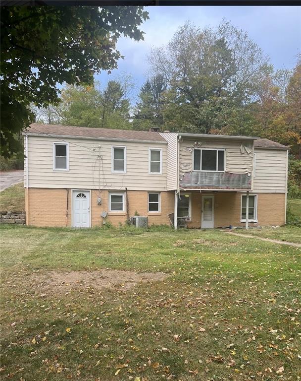 a view of a house with a backyard