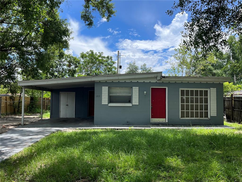 a house that has a tree in front of it