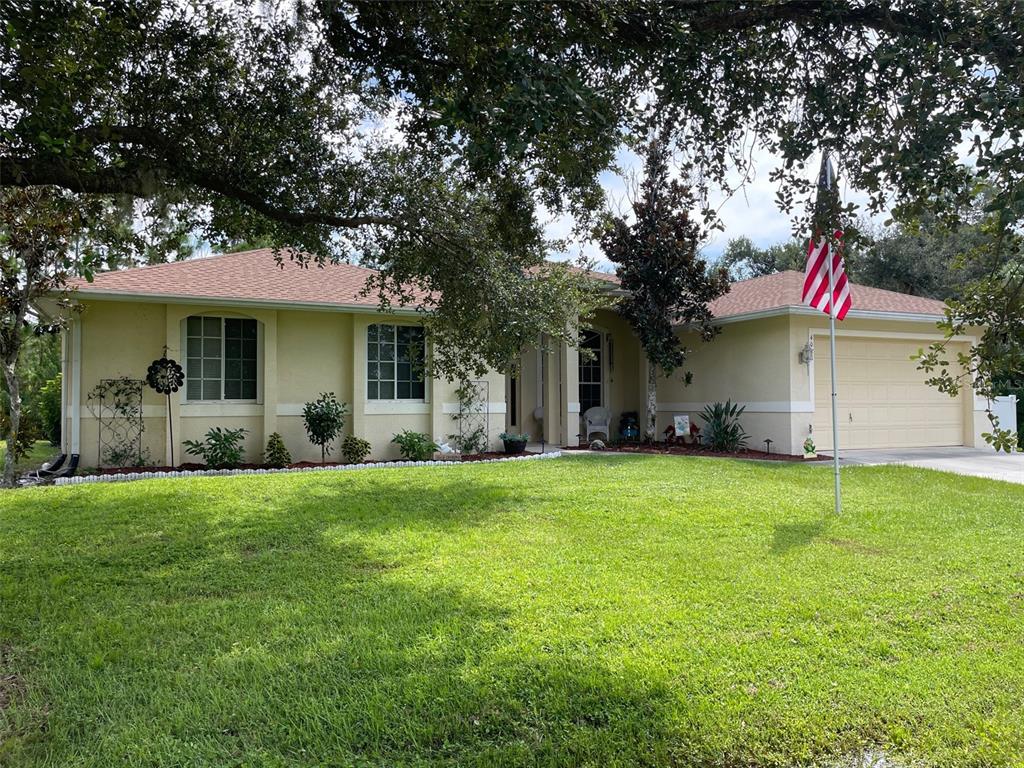 a front view of house with yard and green space