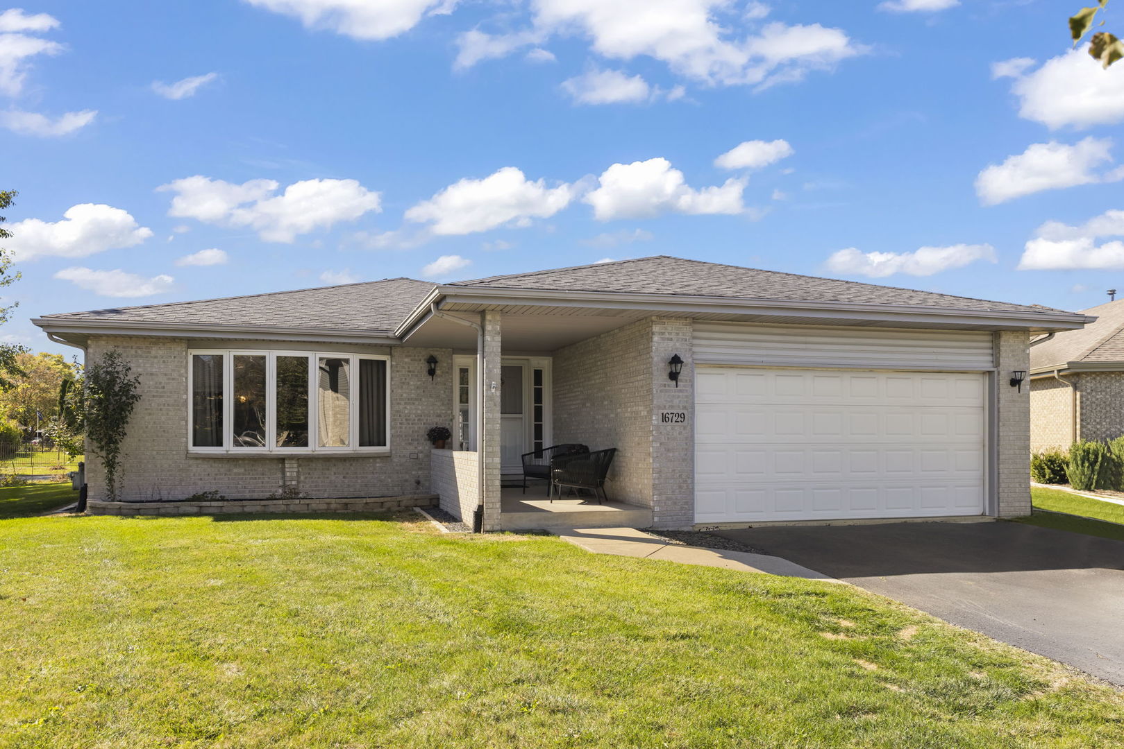 a front view of house having yard