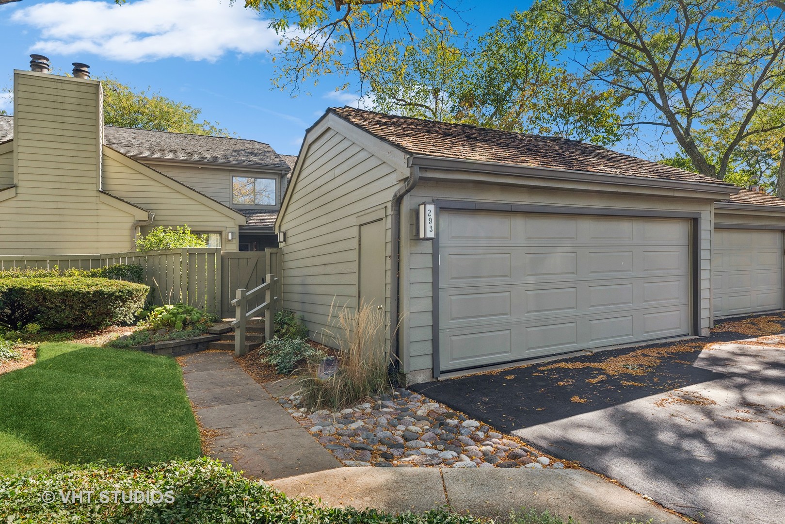 a view of a small house with a small yard