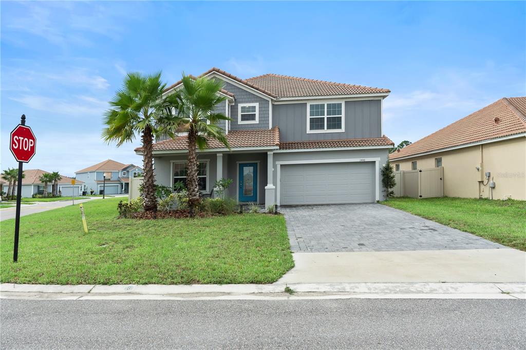 a front view of house with yard and green space