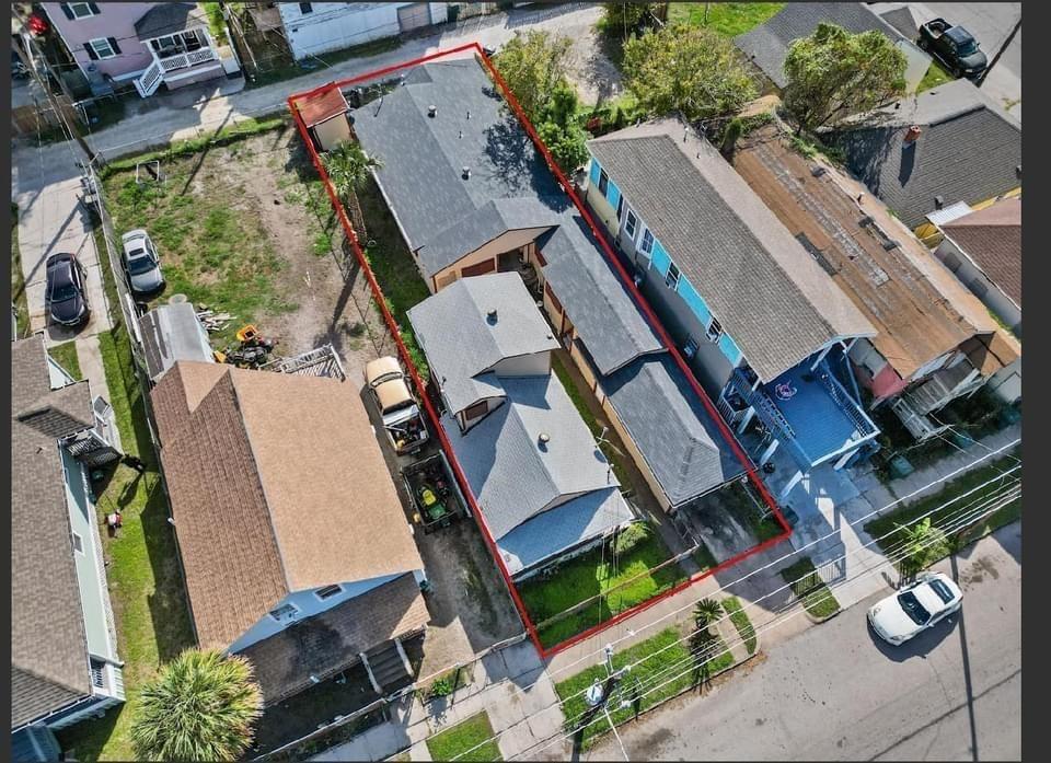 an aerial view of a residential apartment building with a yard