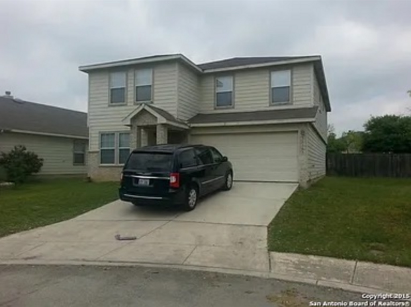 a car parked in front of a house