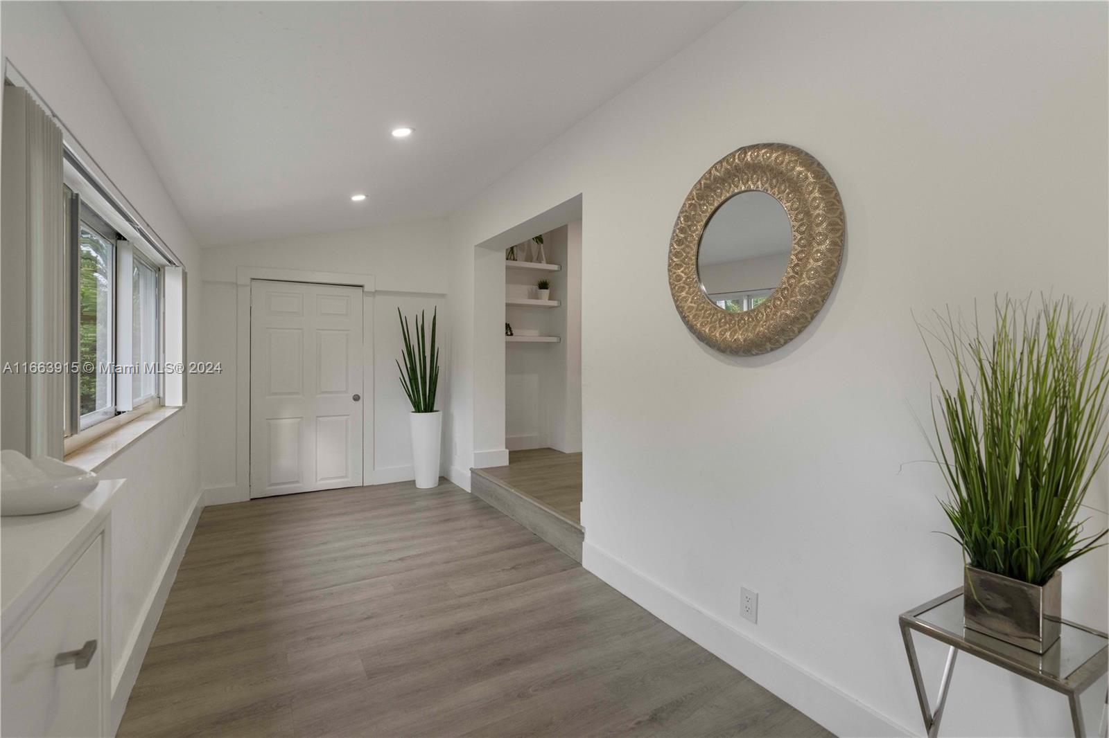 a view of livingroom with furniture and wooden floor