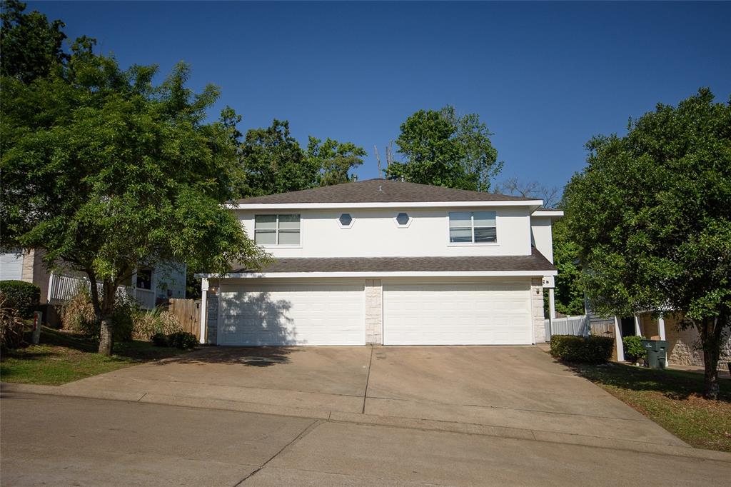 a front view of a house with a garage